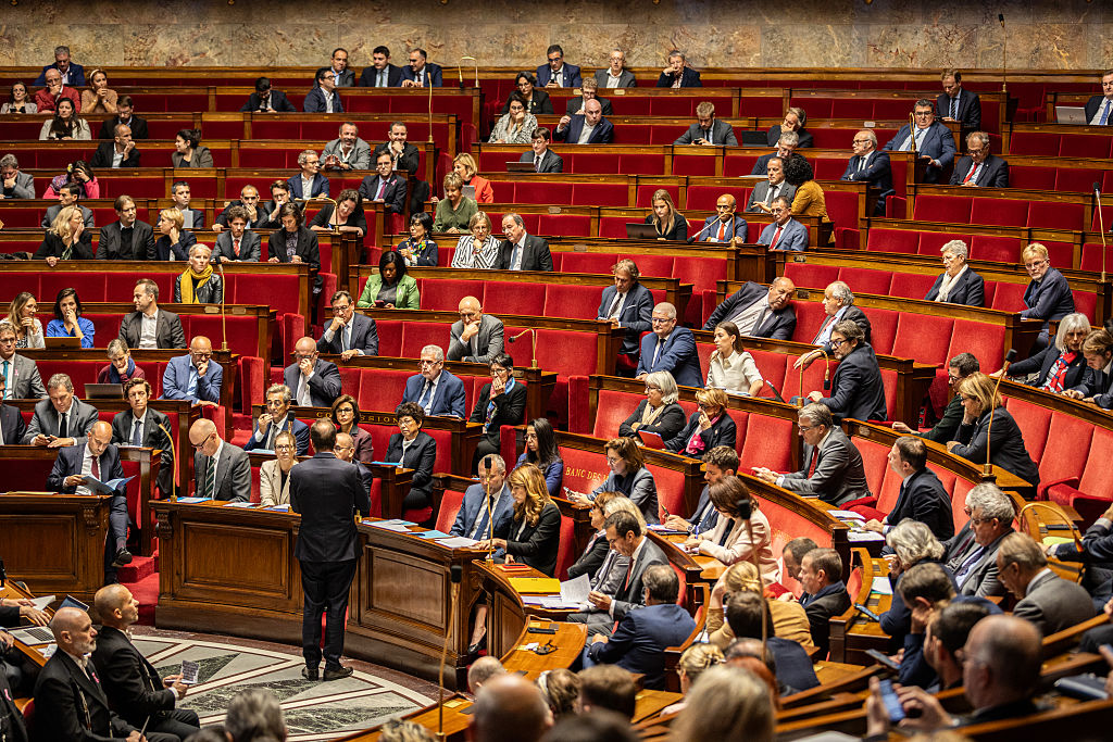 French government survives no-confidence votes as Socialists withhold support